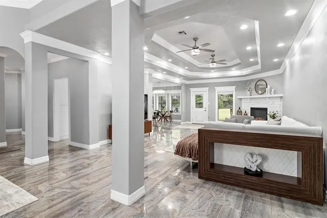 a living room with furniture and a fireplace