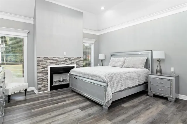 a bedroom with a bed and a fireplace