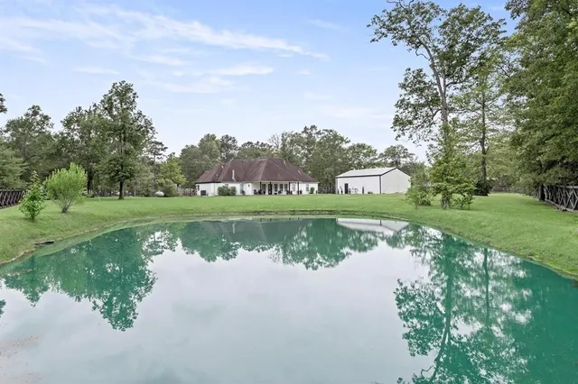 a view of a lake with a house in the background