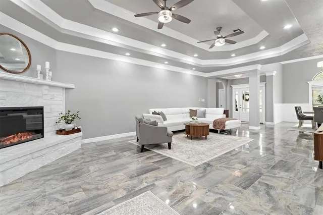 a living room with furniture and a fireplace