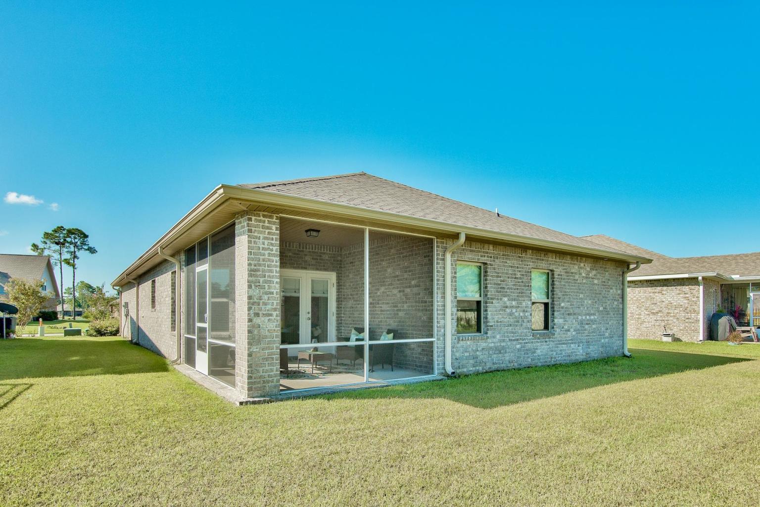 160 Pin Oak Loop Santa Rosa Beach, FL 32459 - Photo 5 of 26 a view of a house with backyard and garden