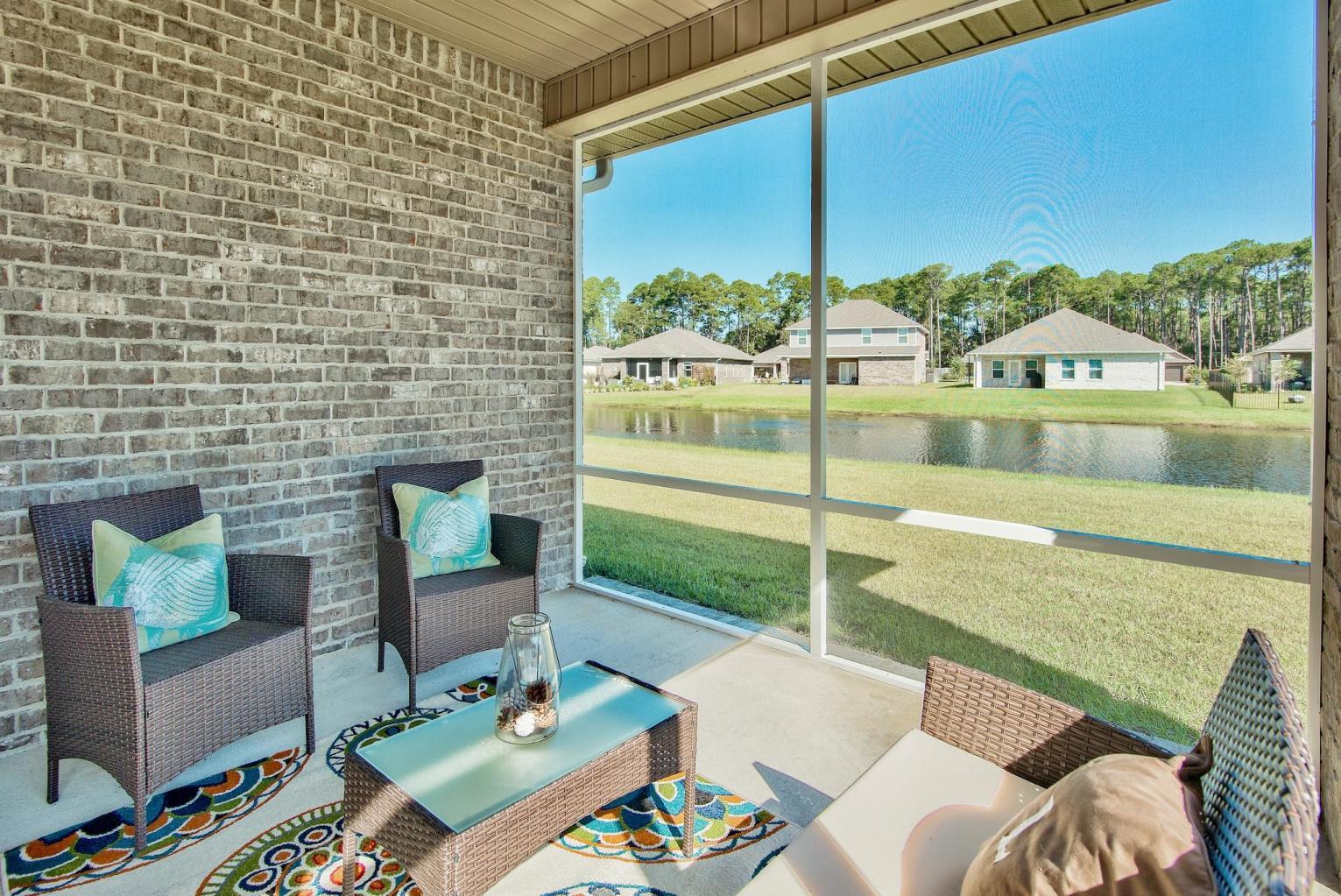 160 Pin Oak Loop Santa Rosa Beach, FL 32459 - Photo 7 of 26 a outdoor living space with furniture and garden view