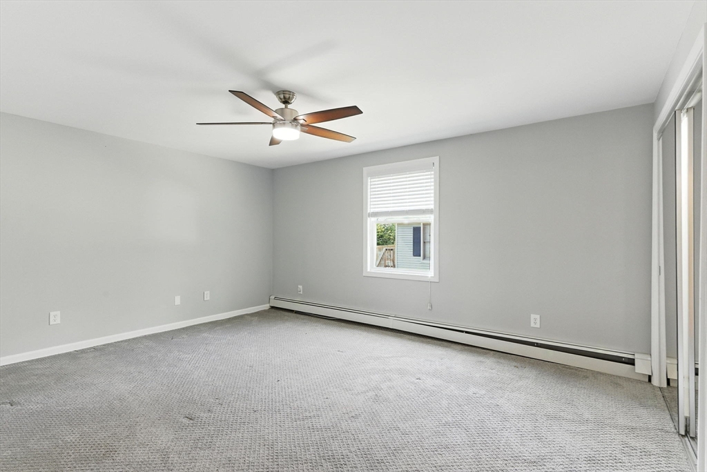 18 Holly Road Holbrook, MA 02343 - Photo 13 of 28 an empty room with a window and a fan