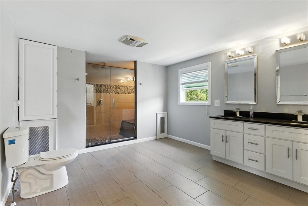 18 Holly Road Holbrook, MA 02343 - Photo 14 of 28 a bathroom with a sink and a mirror