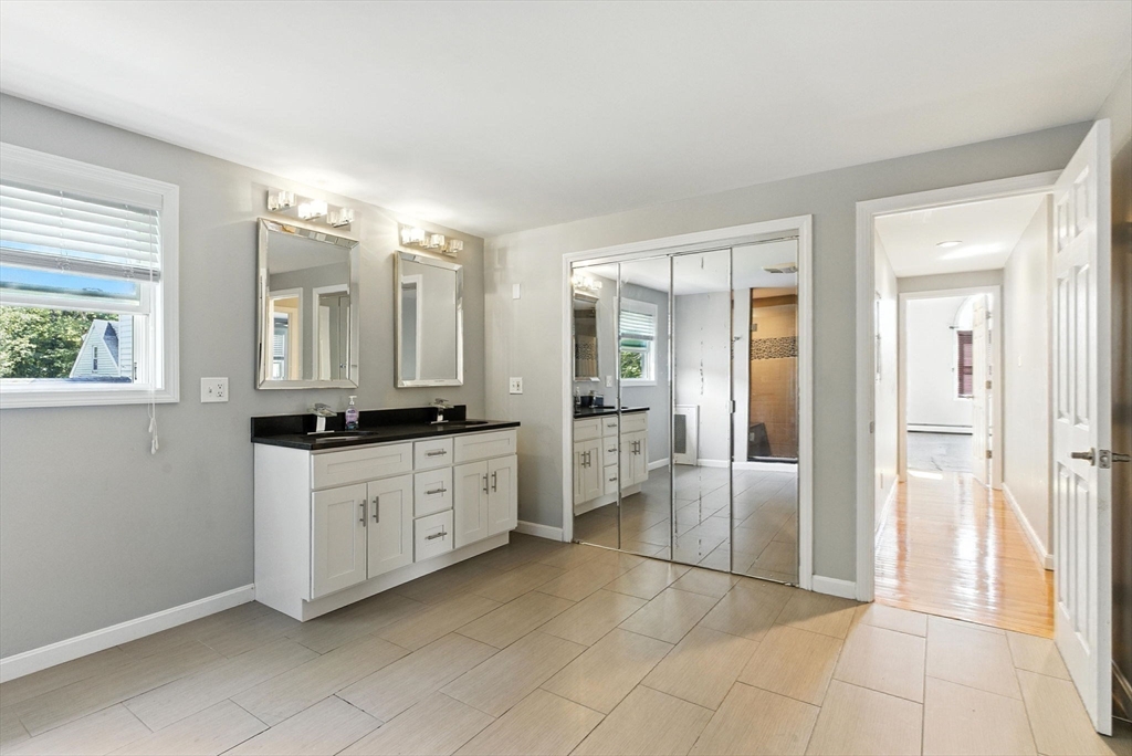 18 Holly Road Holbrook, MA 02343 - Photo 15 of 28 a large bathroom with a glass door shower and sink