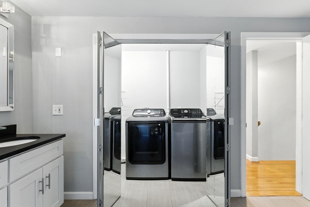 18 Holly Road Holbrook, MA 02343 - Photo 16 of 28 a bathroom with a double vanity and a sink