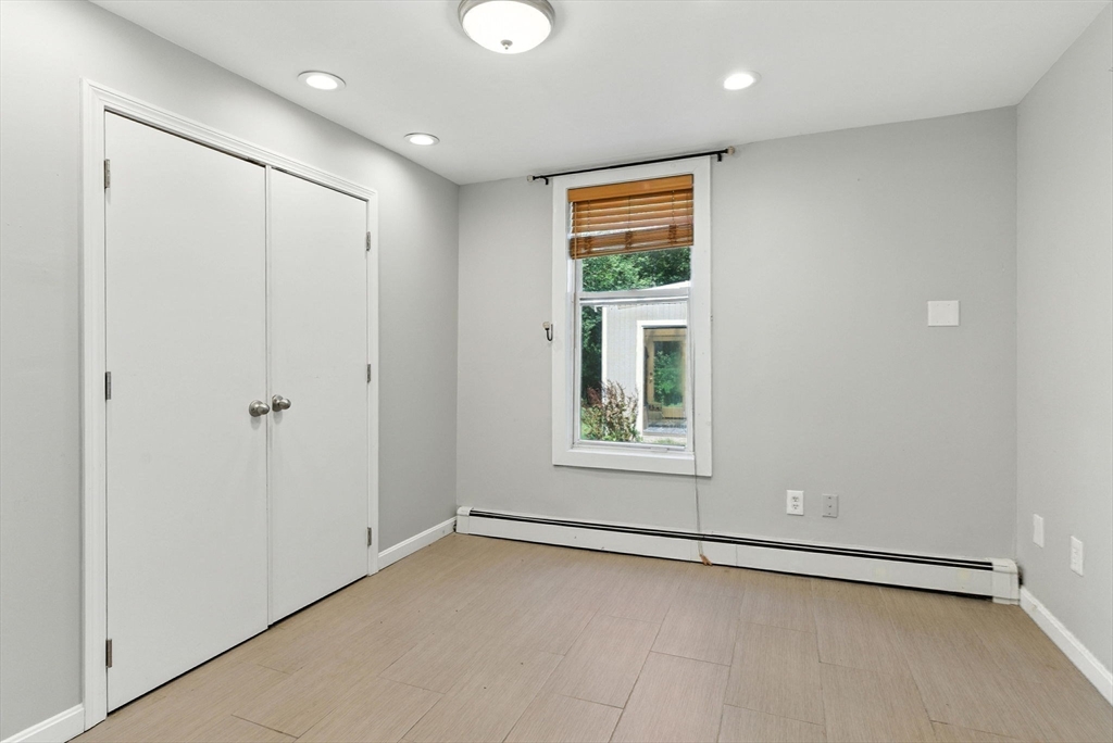 18 Holly Road Holbrook, MA 02343 - Photo 18 of 28 an empty room with a empty space and windows