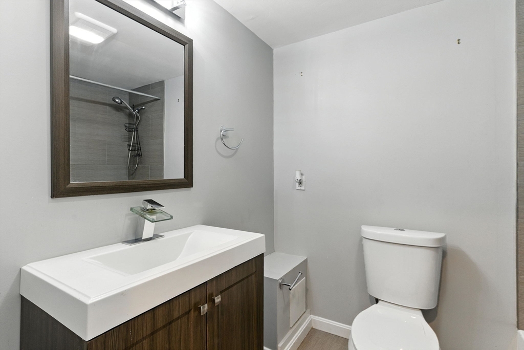 18 Holly Road Holbrook, MA 02343 - Photo 19 of 28 a bathroom with a toilet sink and mirror