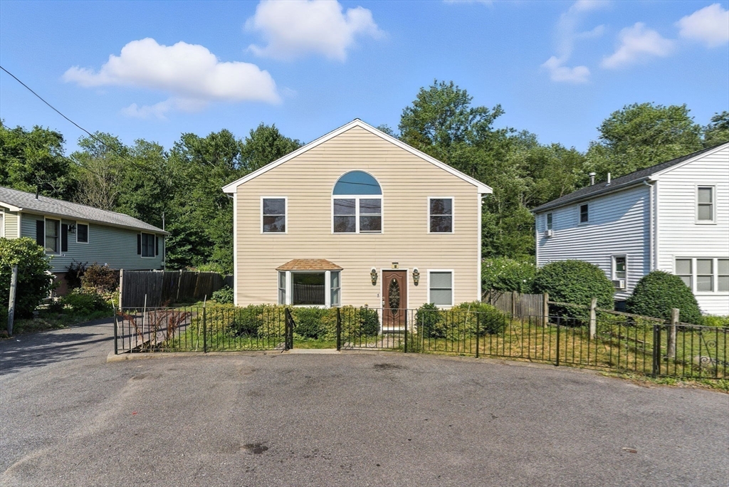 18 Holly Road Holbrook, MA 02343 - Photo 20 of 28 a view of a house with a yard and plants