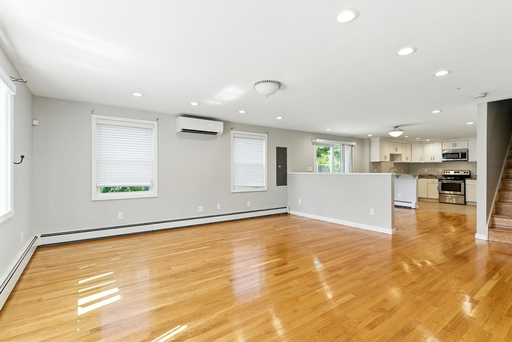 18 Holly Road Holbrook, MA 02343 - Photo 5 of 28 a view of an empty room with kitchen and window