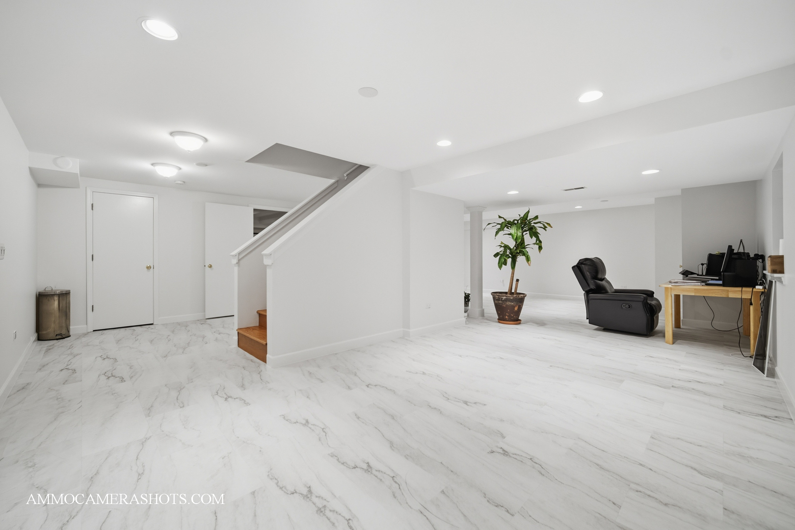 1205 Red Clover Drive Naperville, IL 60564 - Photo 30 of 49 a view of a livingroom with furniture and a flat screen tv