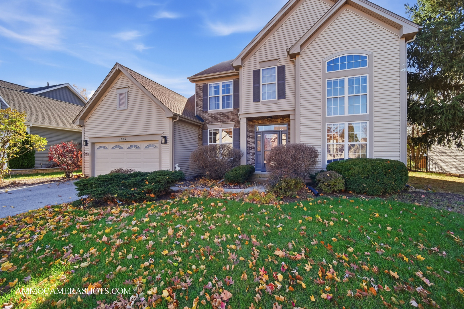 1205 Red Clover Drive Naperville, IL 60564 - Photo 48 of 49 a front view of a house with a yard and garage