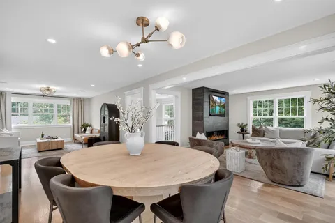 a view of a dining room with furniture window and outside view