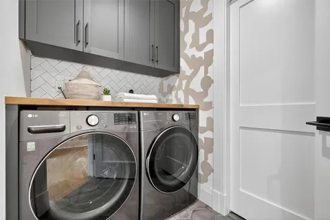a utility room with dryer and washer