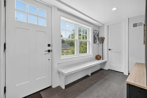 a spacious bathroom with a bathtub and window