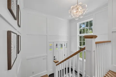 a view of a hallway with windows