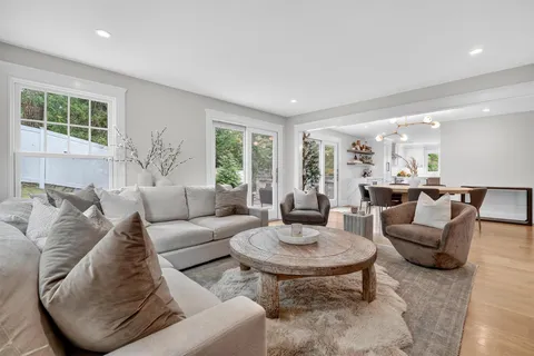 a living room with furniture and a table