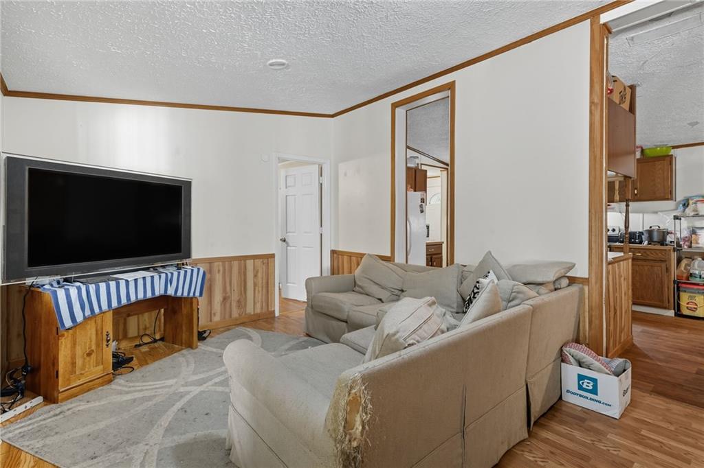 2450 Jones Mountain Road Talking Rock, GA 30175 - Photo 12 of 40 a living room with furniture and a flat screen tv