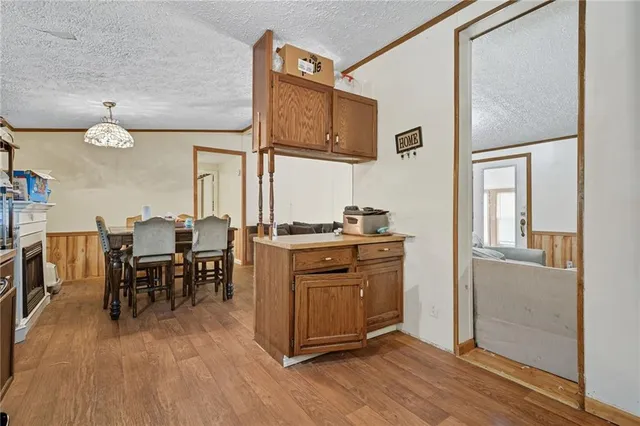 a kitchen with stainless steel appliances granite countertop a refrigerator and microwave