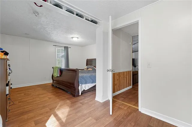 a living room with a furniture and a flat screen tv