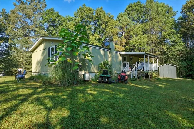 a view of a front of a house with a yard