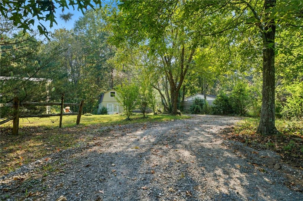 2450 Jones Mountain Road Talking Rock, GA 30175 - Photo 40 of 40 a backyard of a house with lots of green space