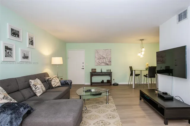 a kitchen with stainless steel appliances granite countertop a refrigerator sink and stove