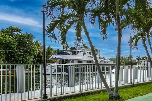 a balcony with wooden floor and city view