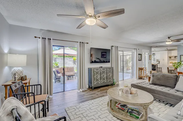 a kitchen with appliances a sink and cabinets