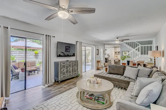 a kitchen with stainless steel appliances a stove a sink and a refrigerator