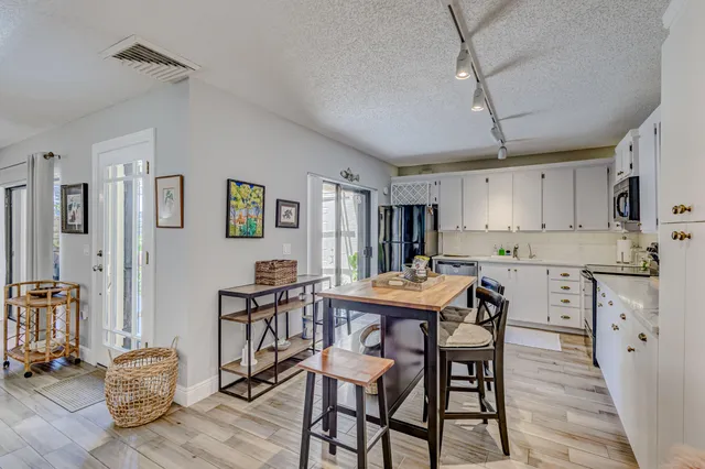 a view of staircase with white walls and a window