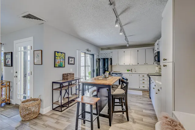a spacious bedroom with a bed and ceiling fan