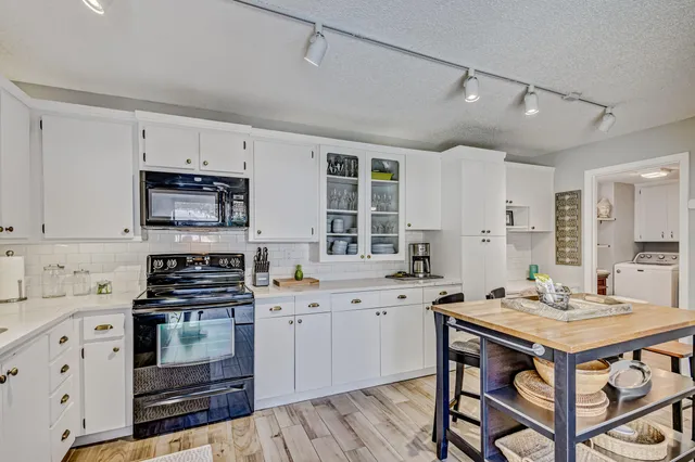 a en suite bathroom with a shower and a double vanity sink mirror