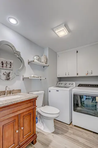 a bedroom with bed and a chandelier