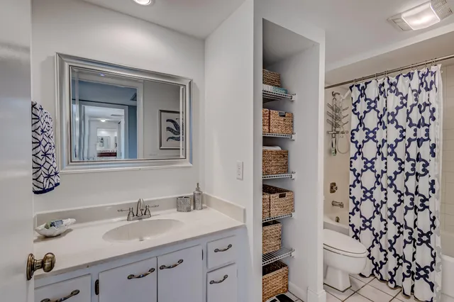 a building with river and trees in the background