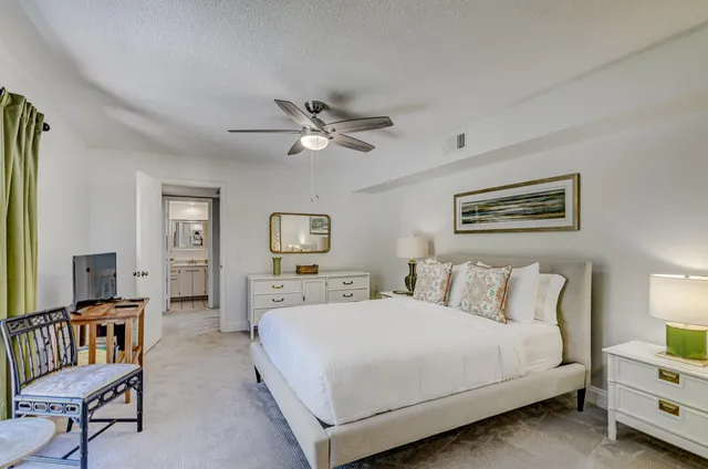 a view of a house with a flower garden