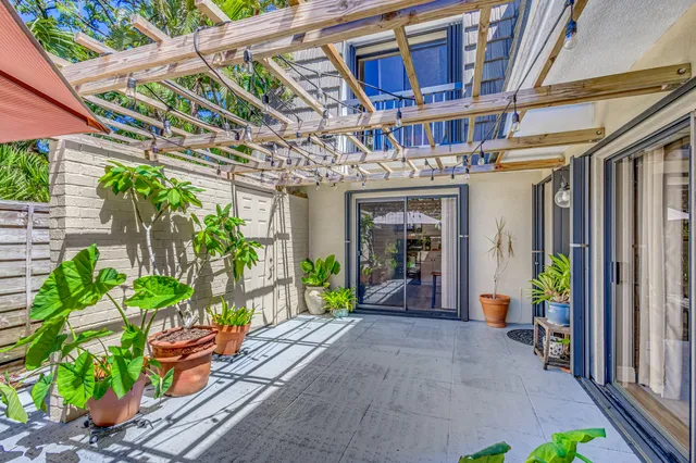 a view of a livingroom with furniture and hardwood floor