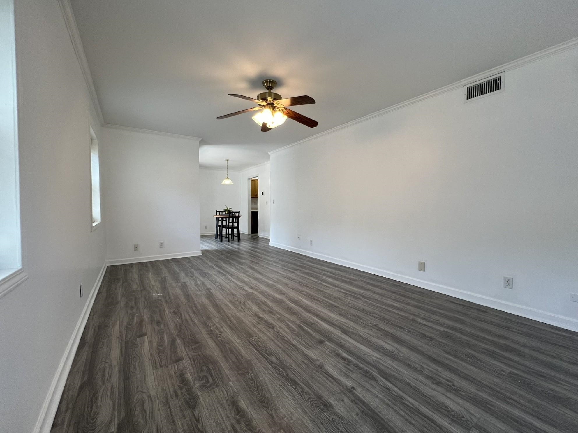 1207 Middle Court, Unit 102 Memphis, TN 38119 - Photo 12 of 31 a view of empty room with wooden floor