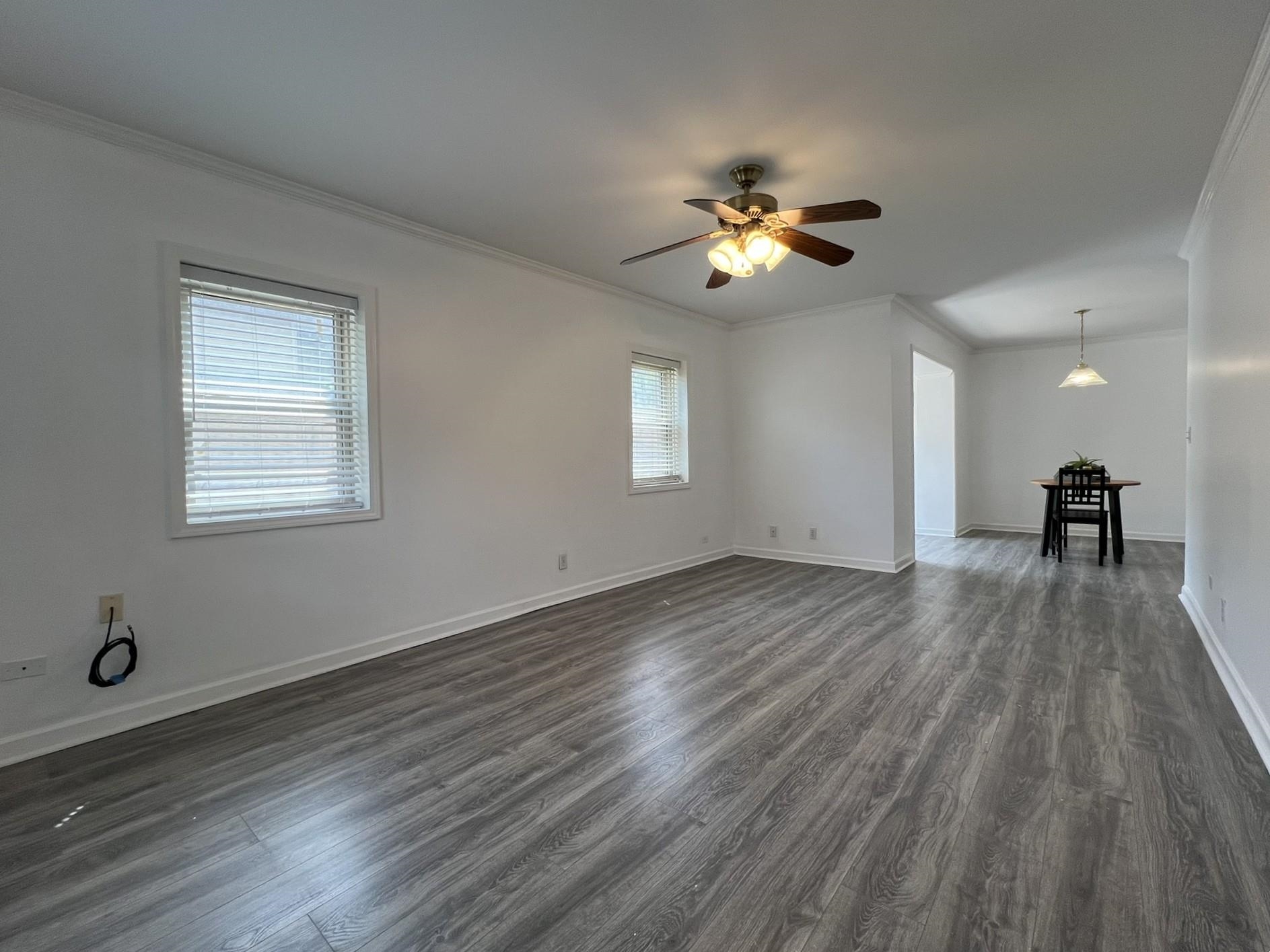 1207 Middle Court, Unit 102 Memphis, TN 38119 - Photo 13 of 31 a view of empty room with wooden floor and fan