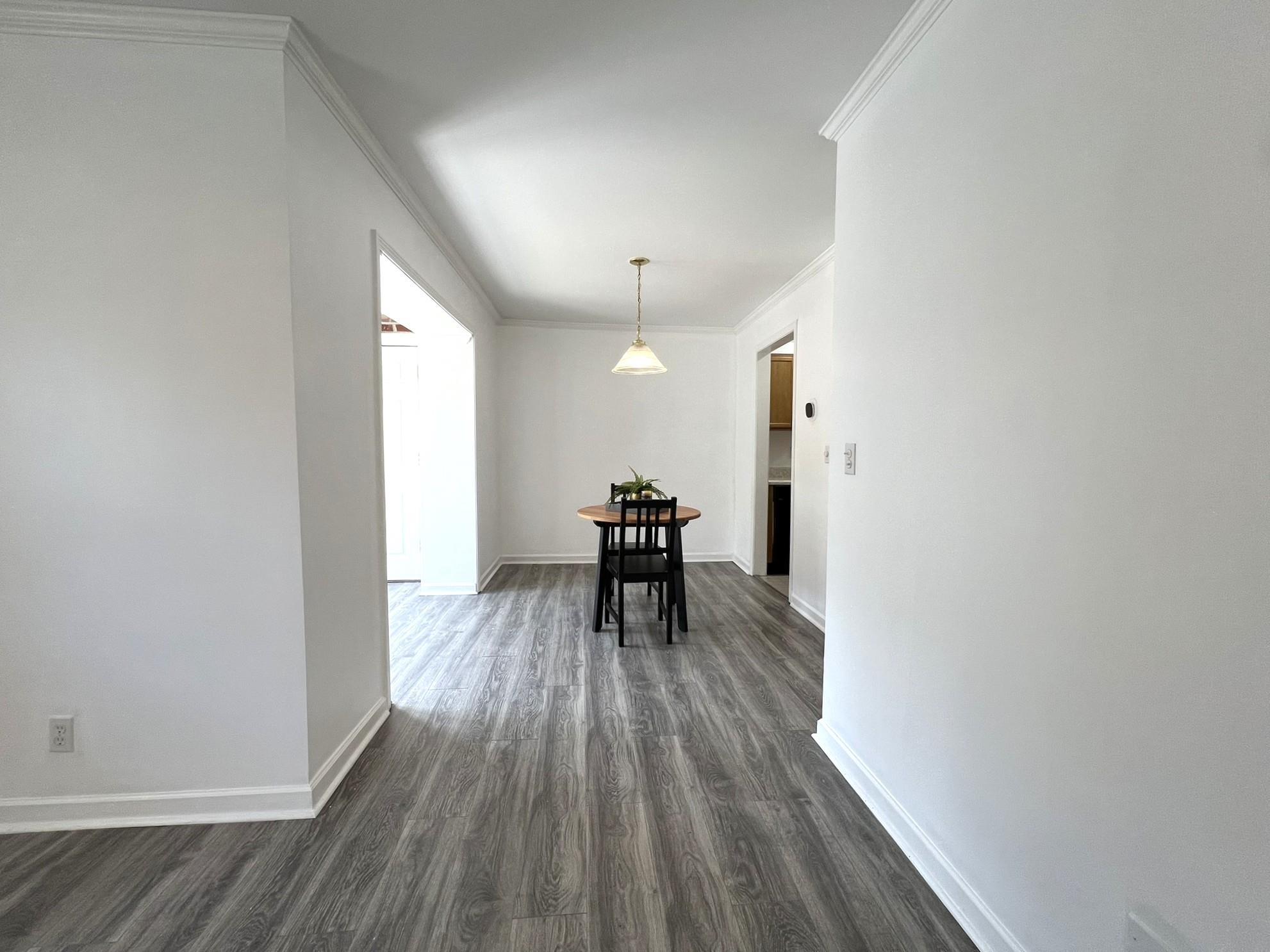 1207 Middle Court, Unit 102 Memphis, TN 38119 - Photo 14 of 31 a view of a room with wooden floor and a hallway