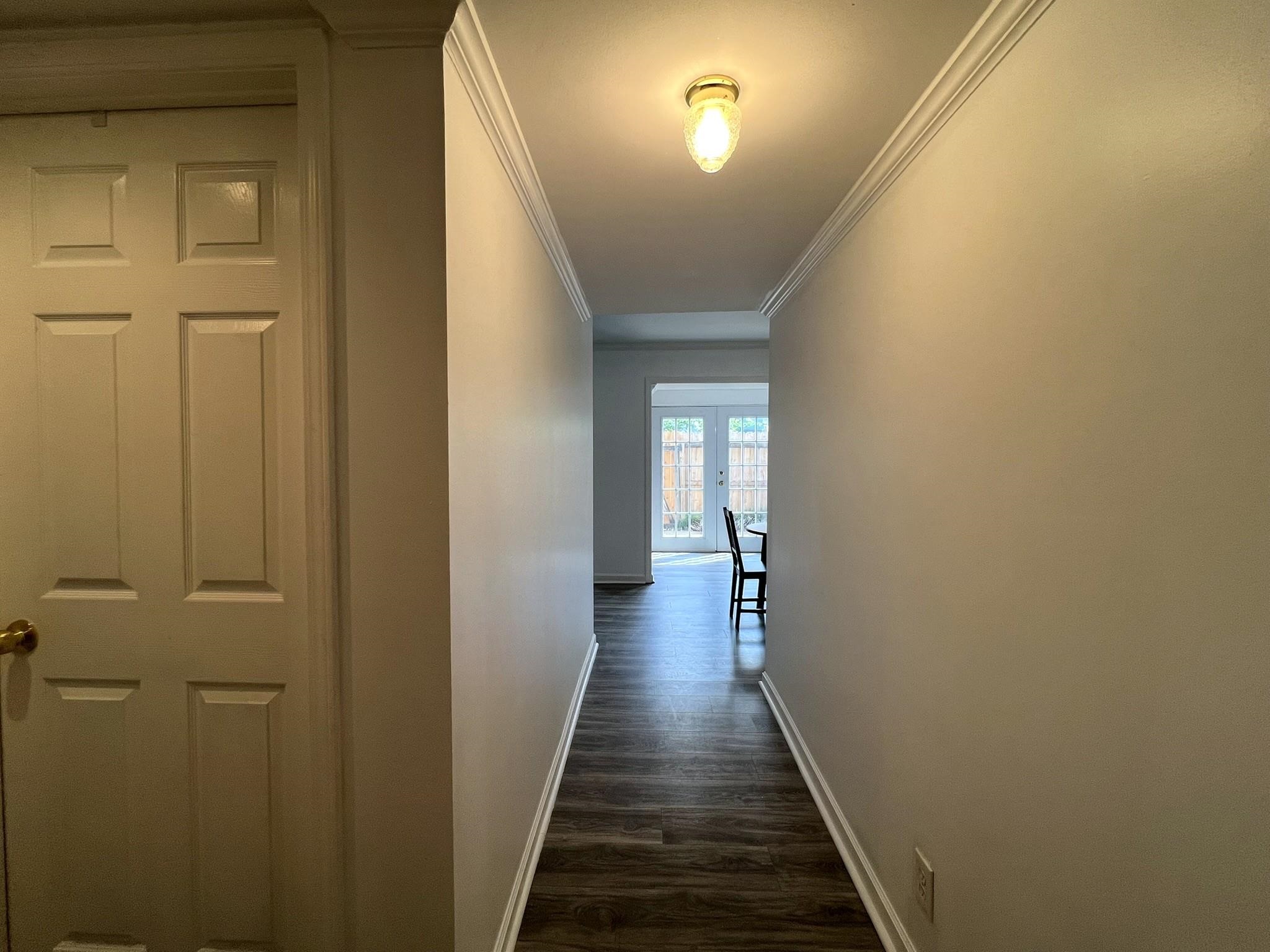 1207 Middle Court, Unit 102 Memphis, TN 38119 - Photo 4 of 31 a view of a hallway with wooden floor
