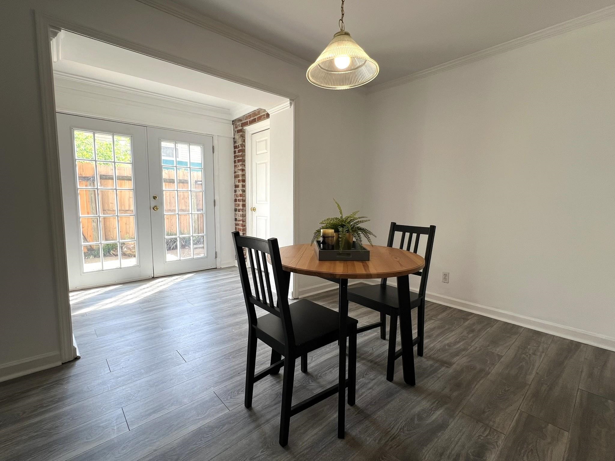 1207 Middle Court, Unit 102 Memphis, TN 38119 - Photo 5 of 31 a view of a dining room with furniture wooden floor and chandelier