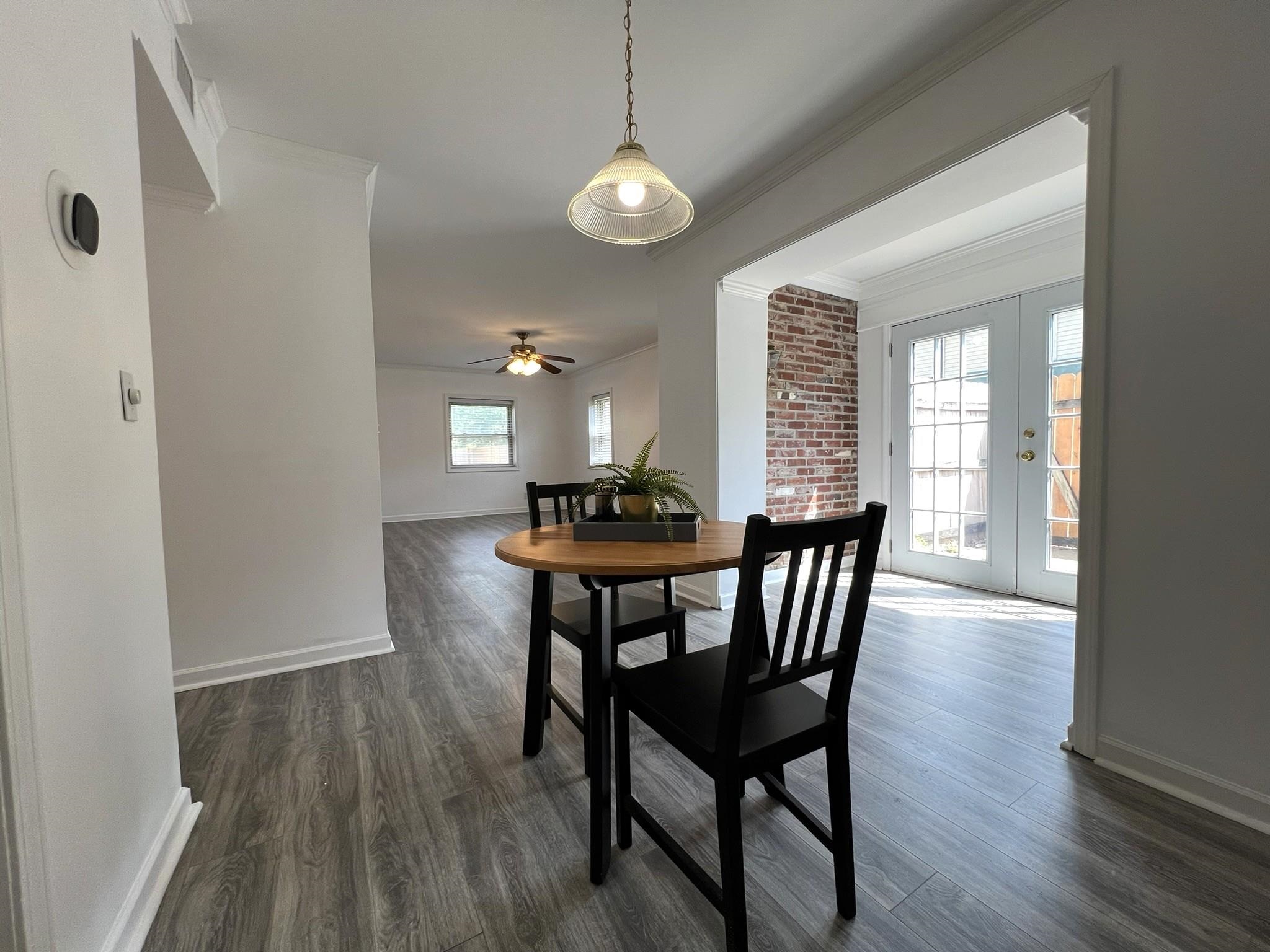 1207 Middle Court, Unit 102 Memphis, TN 38119 - Photo 9 of 31 a view of a dining room with furniture and wooden floor
