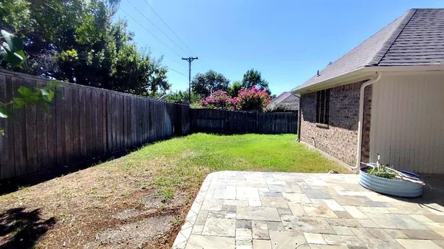 a view of a backyard with a garden