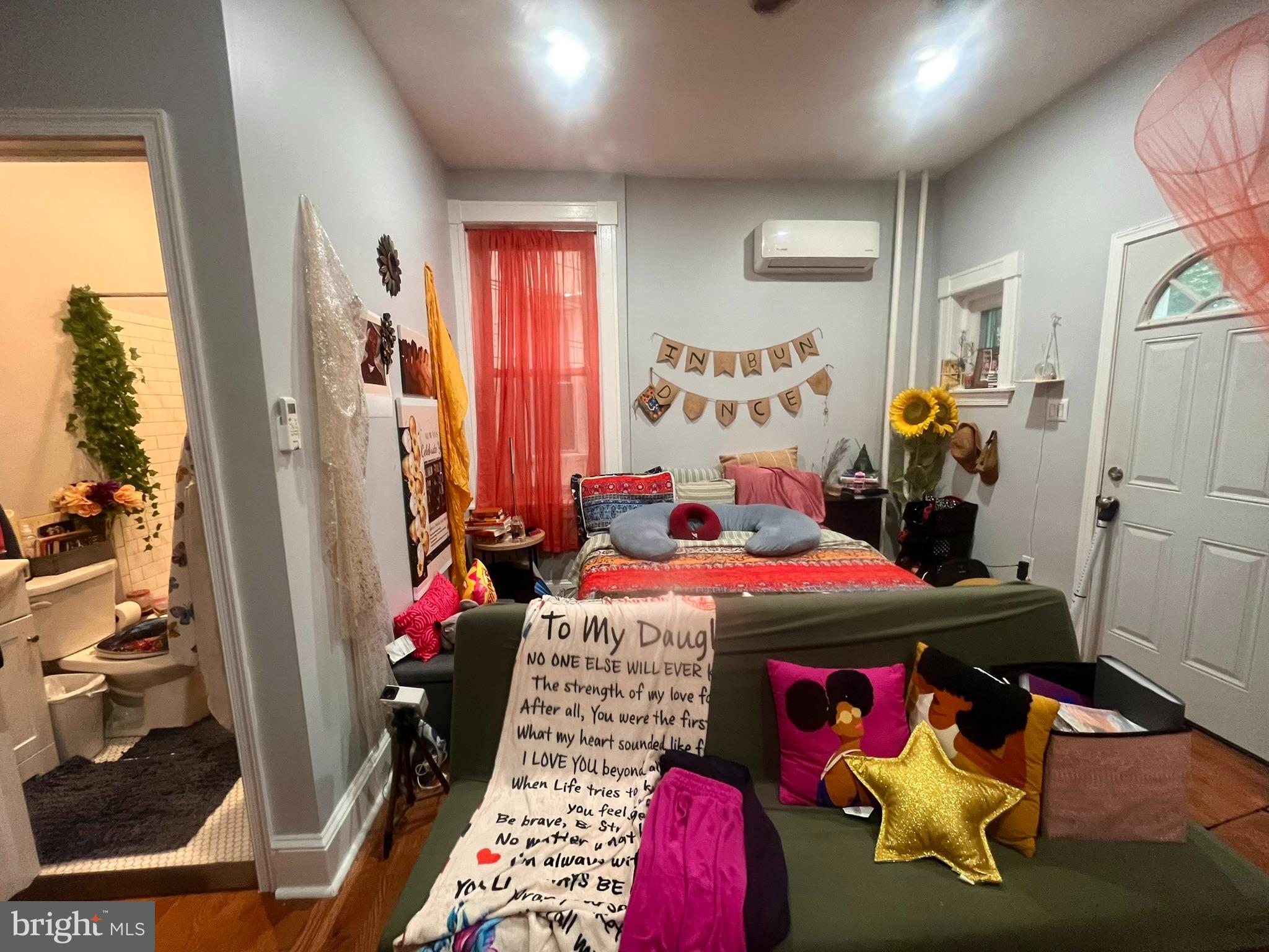 5028 Walnut Street, Unit 1F Philadelphia, PA 19139 - Photo 26 of 32 a bedroom with furniture and a bed