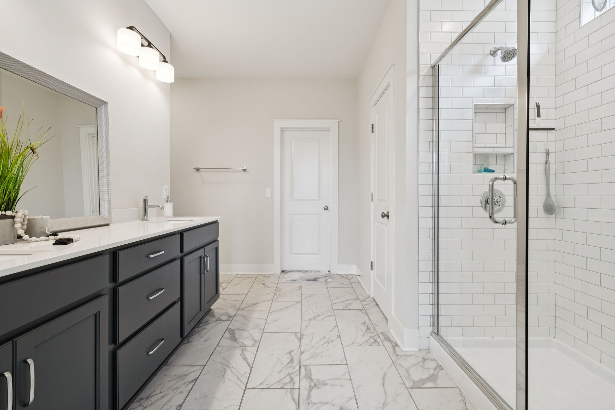 3737 Felipe Way Murfreesboro, TN 37129 - Photo 20 of 45 a spacious bathroom with a double vanity sink a mirror and a shower