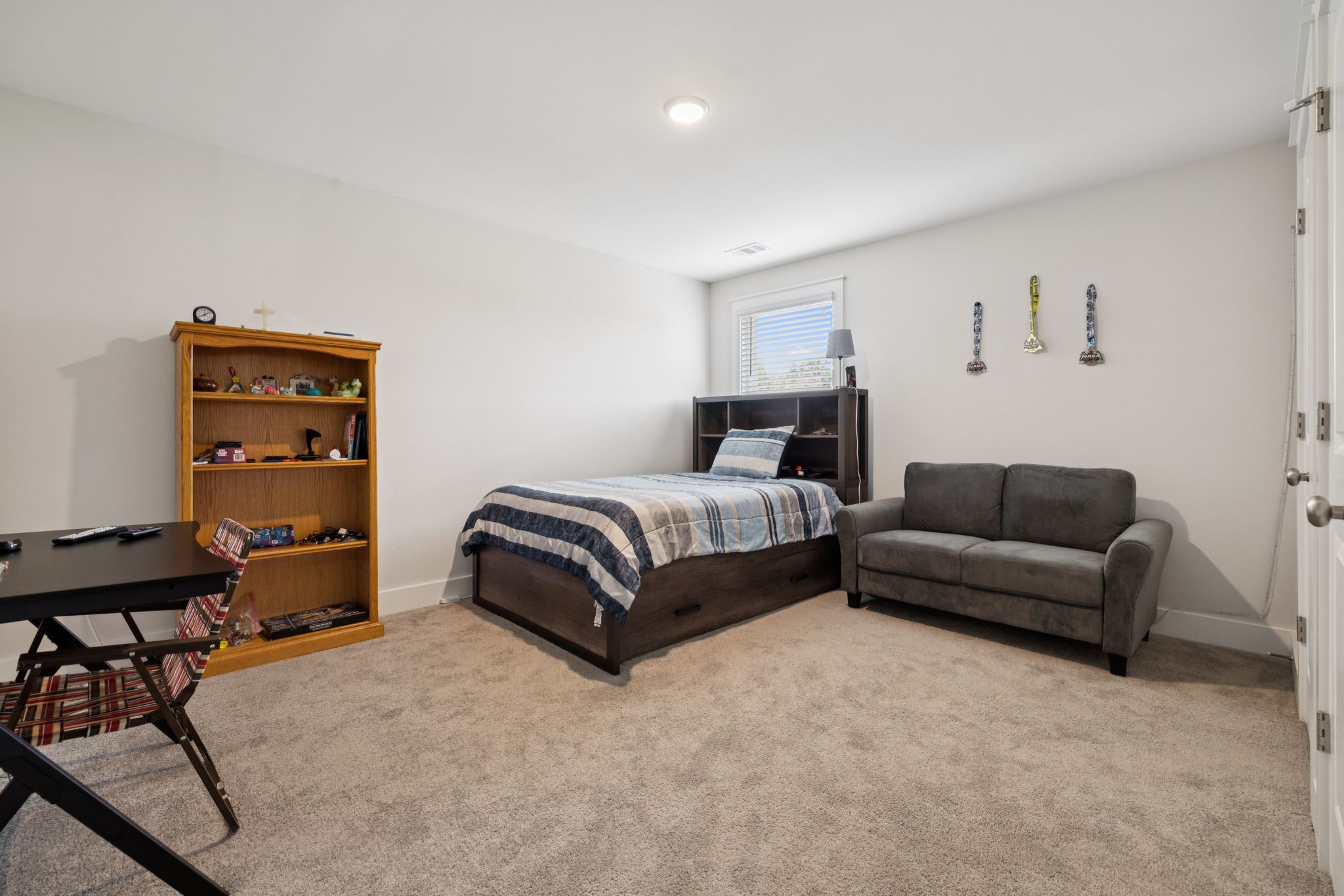 3737 Felipe Way Murfreesboro, TN 37129 - Photo 28 of 45 a bedroom with a bed and a bookshelf