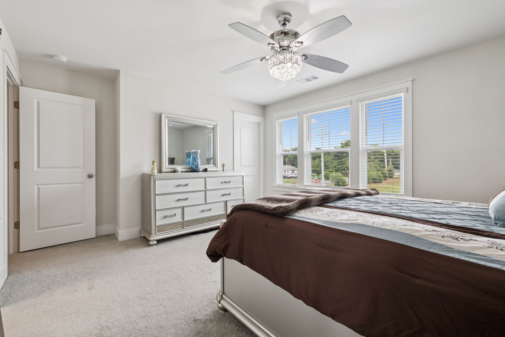 3737 Felipe Way Murfreesboro, TN 37129 - Photo 37 of 45 a spacious bedroom with a large bed and a chandelier