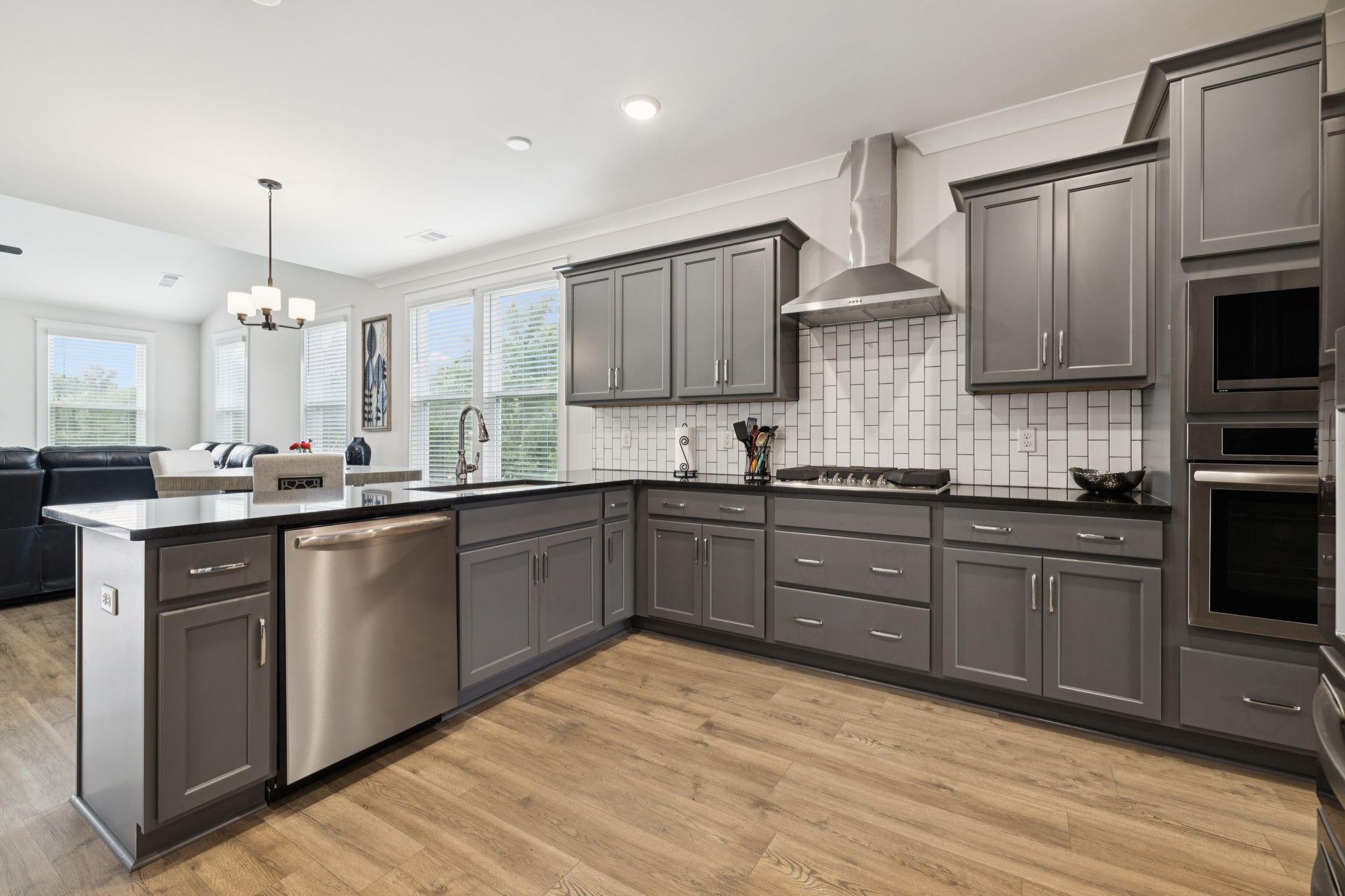 3737 Felipe Way Murfreesboro, TN 37129 - Photo 8 of 45 a kitchen with stainless steel appliances granite countertop a sink a stove a refrigerator cabinets and wooden floor