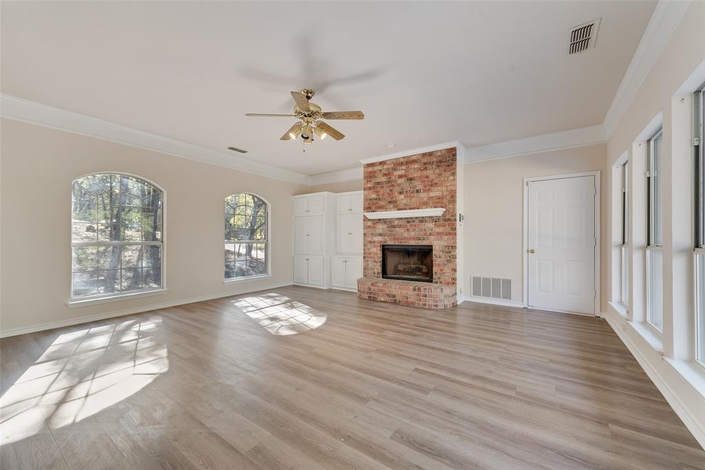 421 Roland Drive Keller, TX 76248 - Photo 12 of 40 a view of an empty room with a window and fireplace